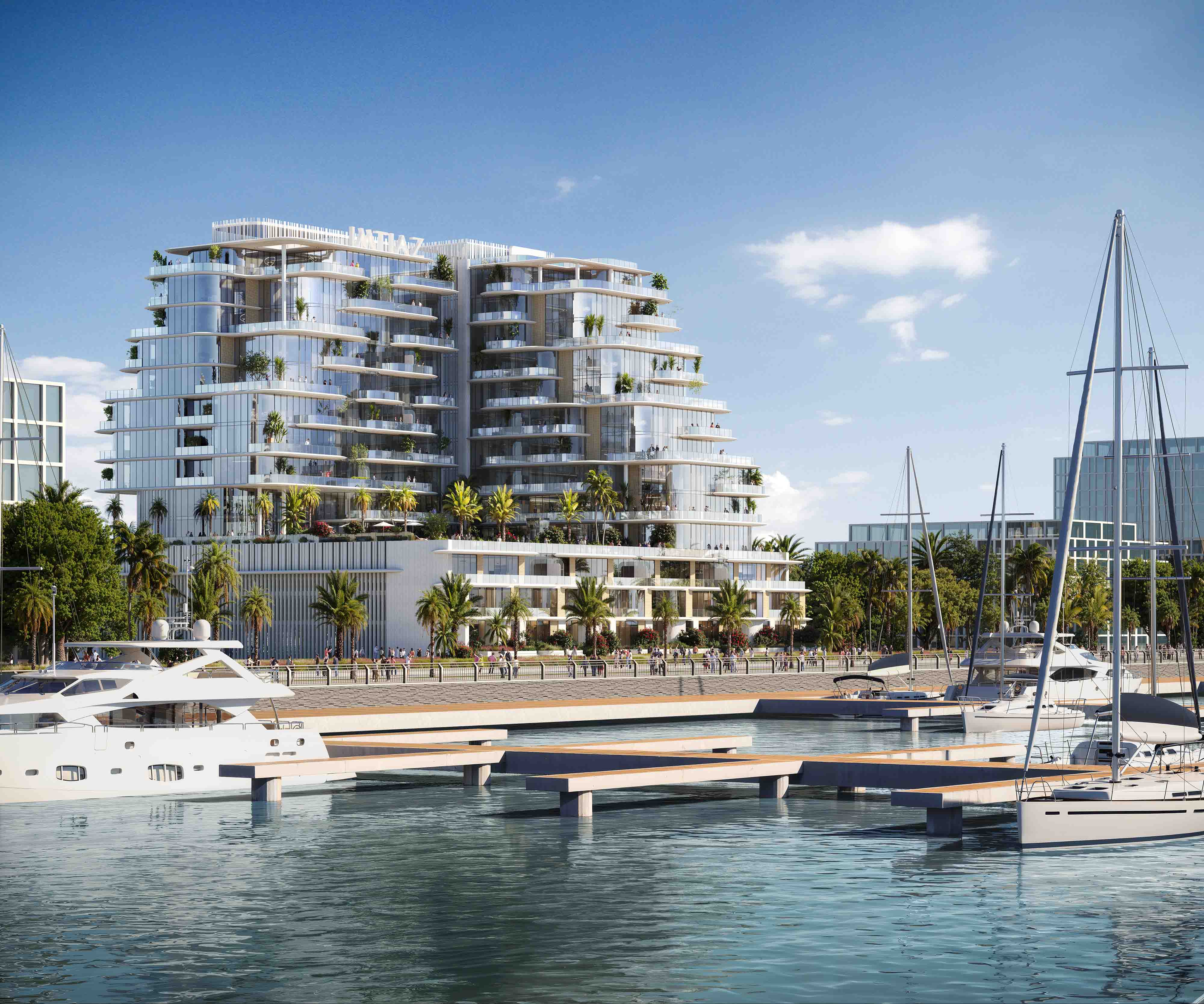 Cotier House 2 By Imtiaz A modern waterfront building with glass facades, palm trees, and luxury yachts docked in the marina.